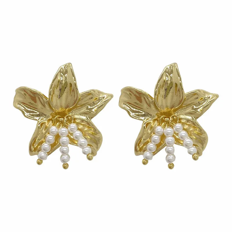 A pair of gold H1795 coloured flower-shaped drop earrings with a pearl centre.