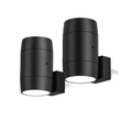 Small white plug-in night lamp with a rotatable light head on a bedside table.