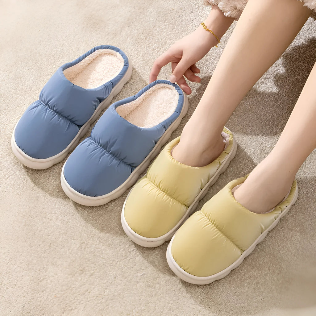 Blue couple's winter slippers with artificial leather upper, plush lining, and thick rubber anti-slip sole.