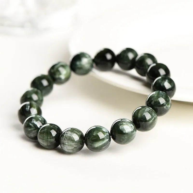 Green Dragon Crystal bracelet with round 8-9mm beads and a single ring clasp.