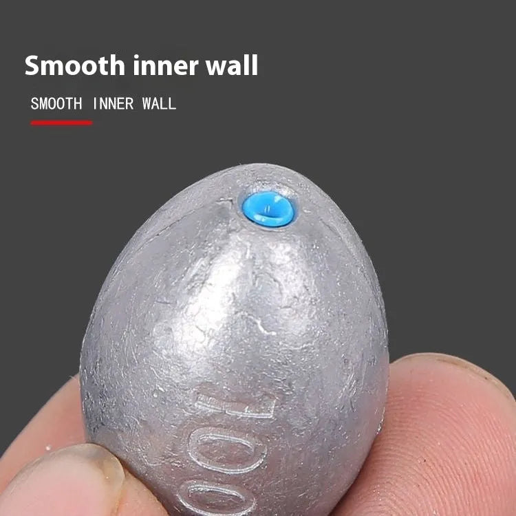 Olive-shaped fishing sinker with scale texture and plastic core construction for sea fishing