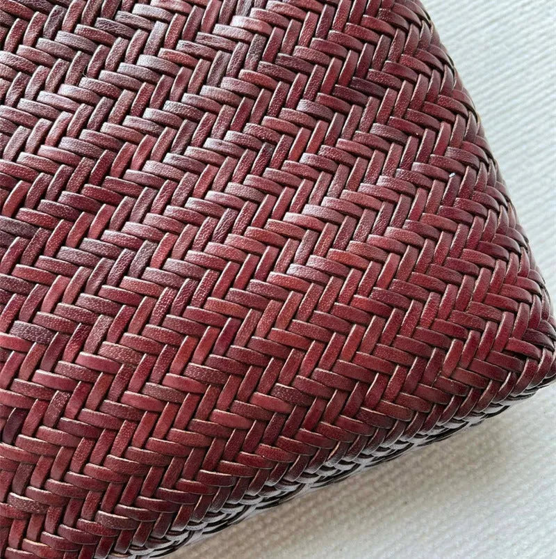 Handmade brown woven tote bag made from vintage top layer cowhide leather with a three-dimensional pocket.