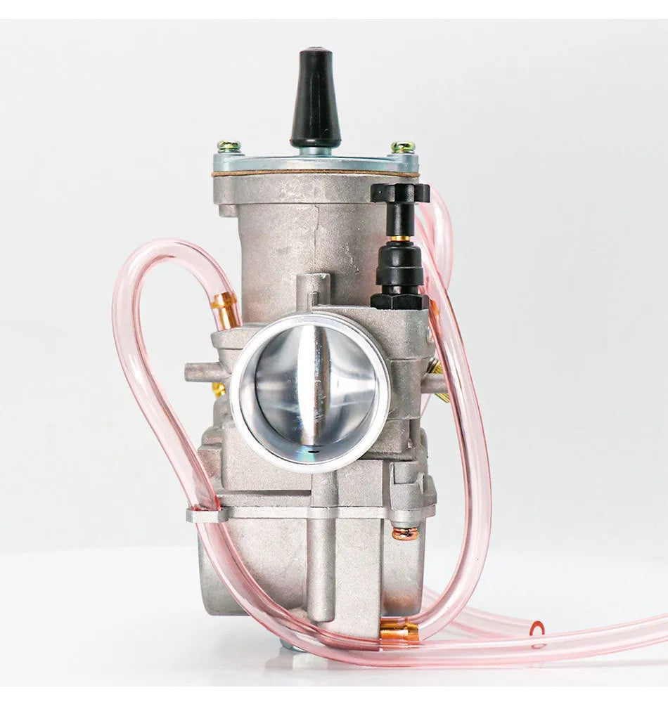 Seven sandblasted PWK motorcycle carburettors in sizes 21mm, 24mm, 26mm, 28mm, 30mm, 32mm, and 34mm.