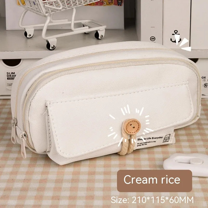 Korean style canvas pencil case in green, beige, blue, or grey, showing large capacity for pens.
