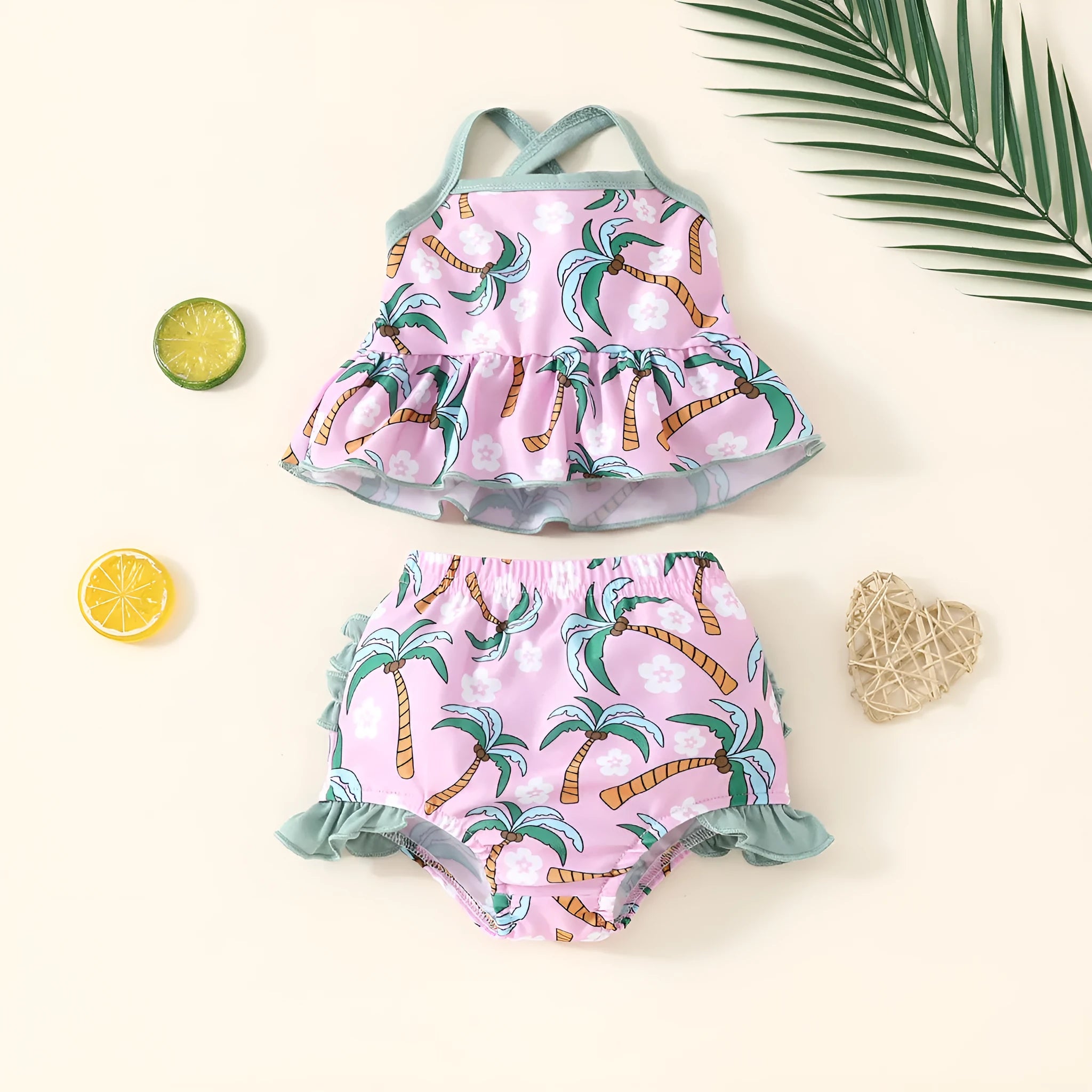 White baby swimsuit set with top and shorts on hanger