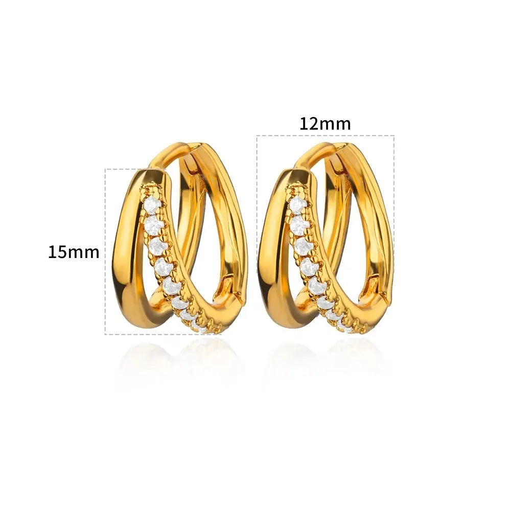 Women's copper butterfly earrings with geometric heart, star, and bow shapes and cubic zirconia stones.