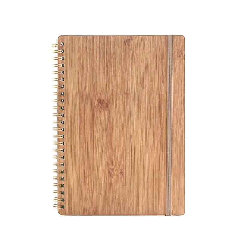Erasable coil notebook with stone paper, showing a black cover option and a pen on a wooden desk.