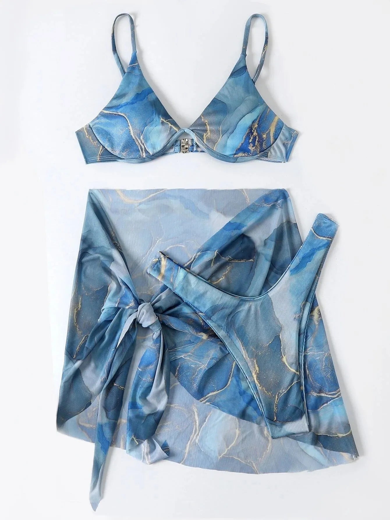 Women's marble print bikini set showing three pieces: skirt, bra, and panties in coordinating pattern