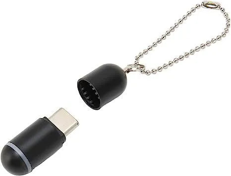 Black capsule infrared remote emitter with Lightning, USB-C, and micro-USB plug options on a white background.