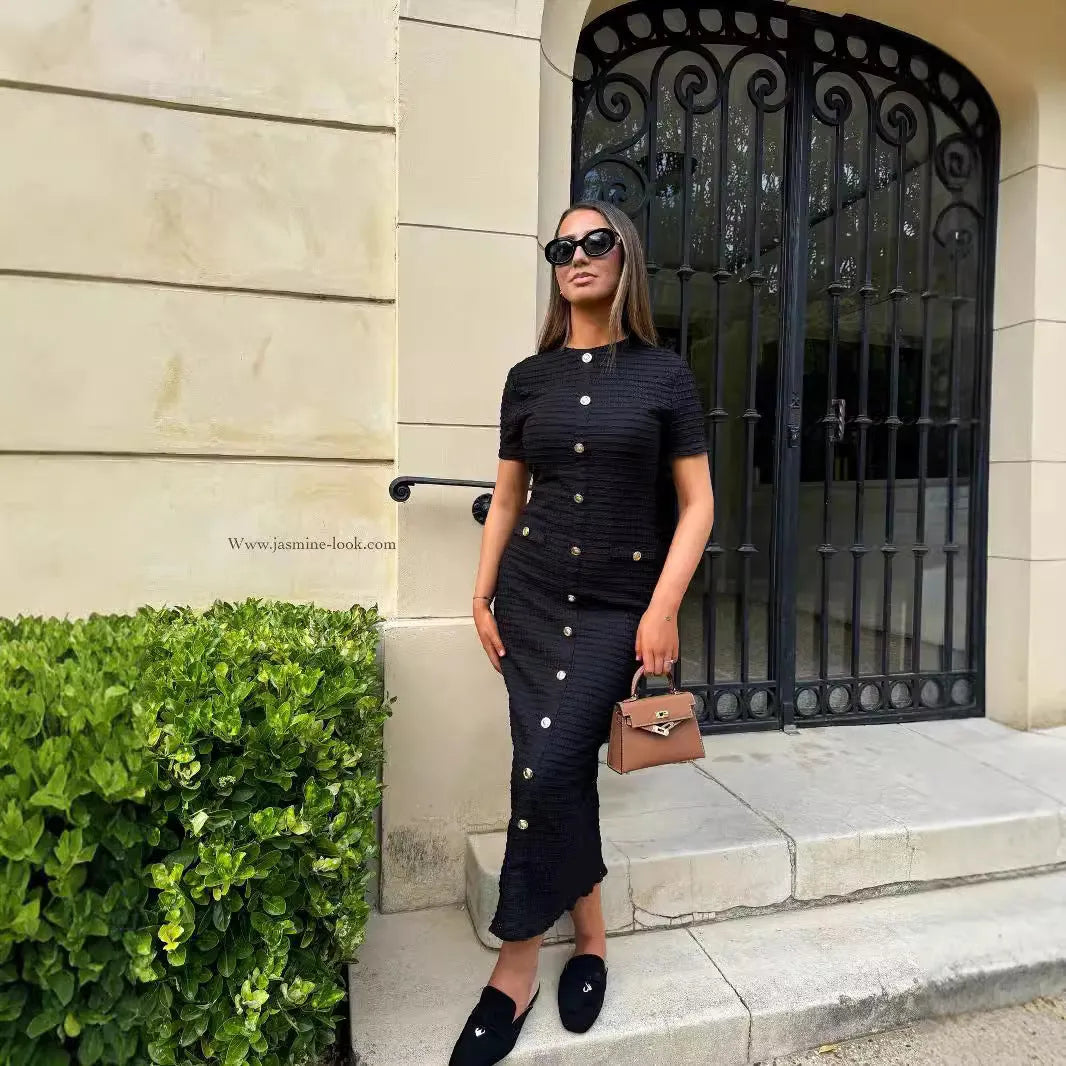 French retro slim fit knitted long sleeve dress in black with button detail and mid waist design