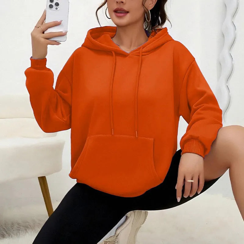 Women's loose grey drawstring hoodie sweatshirt with front kangaroo pocket