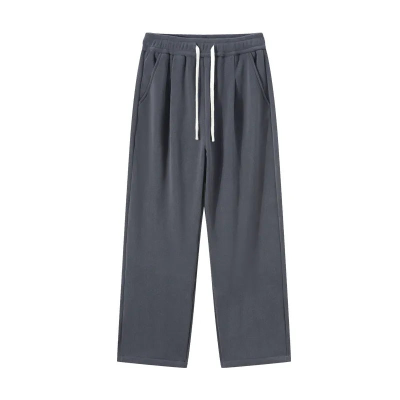 Men's apricot coloured fleece-lined loose fit sports trousers with an elasticated drawstring waist.