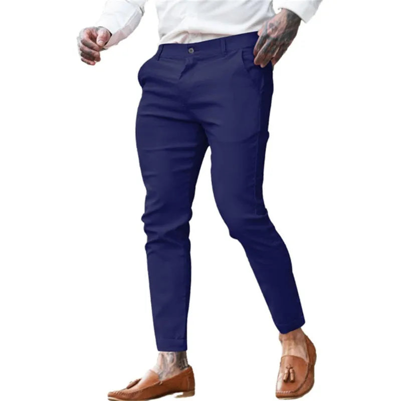 Men's slim fit pencil trousers in cotton twill fabric with stretch, showing mid waist and tapered leg.