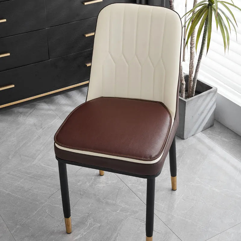 Leather horseshoe-shaped seat cushion shown in beige colour on wooden chair