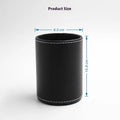 Round black leather pen container with 8.0cm diameter on wooden desk