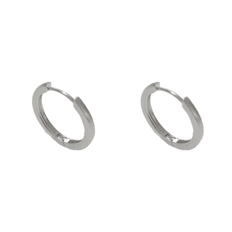 Geometric women's ear clip with real gold plating in gold colour showing round eyelet design