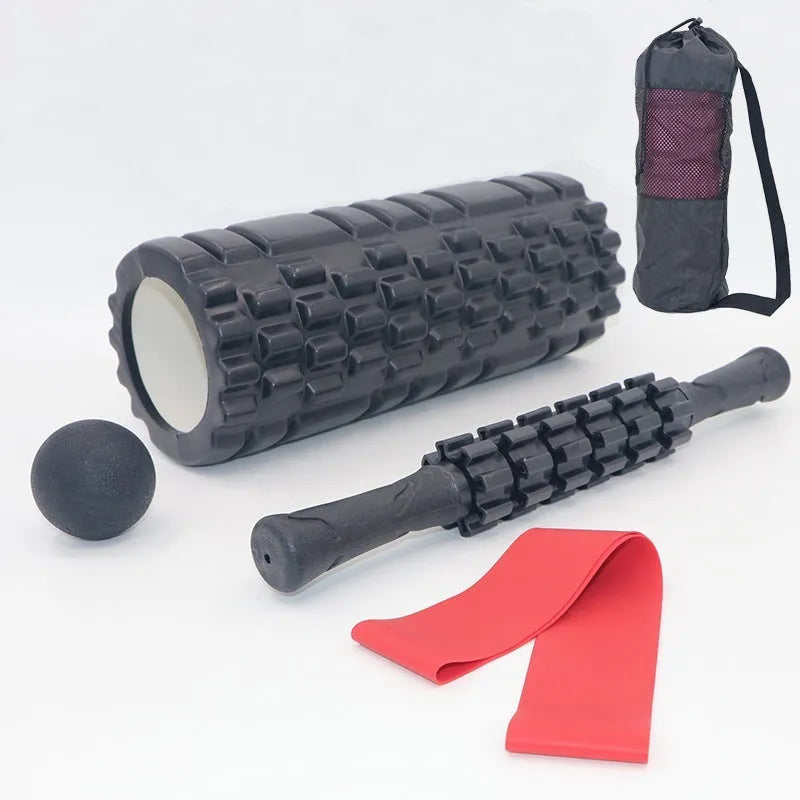 Black 33cm long fitness foam roller with six segmented pieces on a plain background.