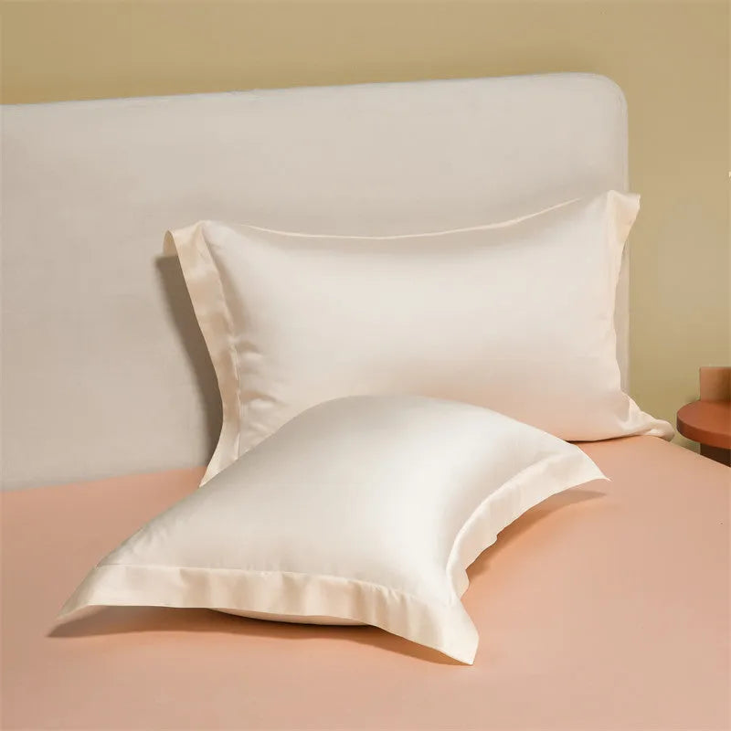 Four-piece Lenzing Tencel quilt sheet set in Antique White showing quilt cover and pillowcases with modern simple style