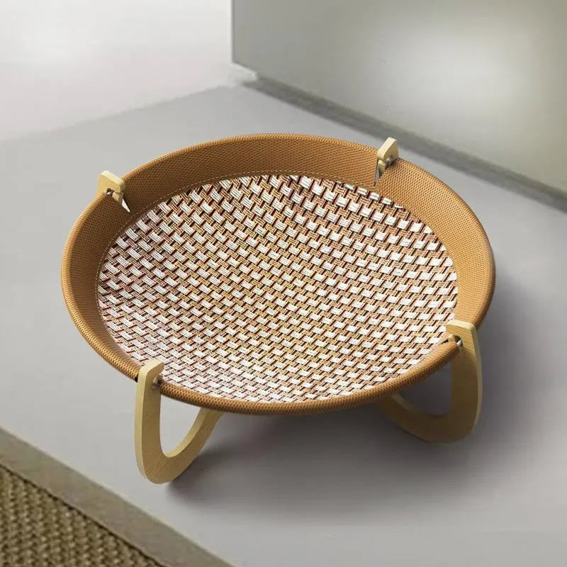 Brown woven rattan pet hammock bed for cats and small dogs on a white floor