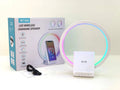 White smart Bluetooth speaker with wireless charging pad and ambient light on top.