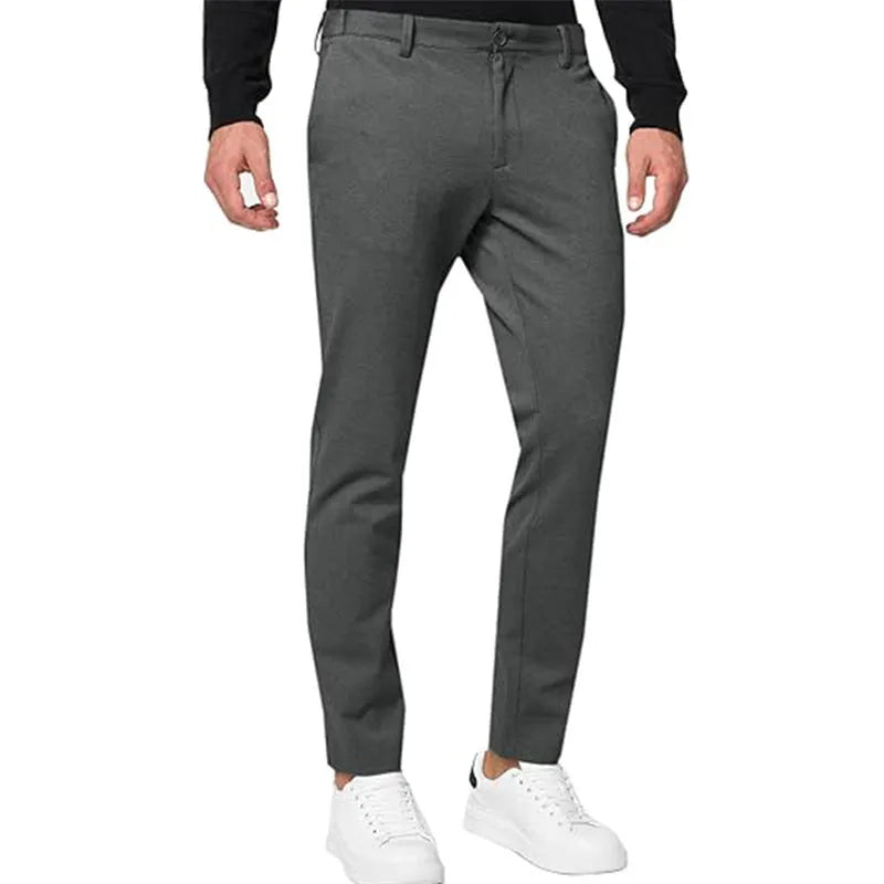 Men's slim-fit tapered chino trousers in a cotton blend stretch fabric on a hanger.