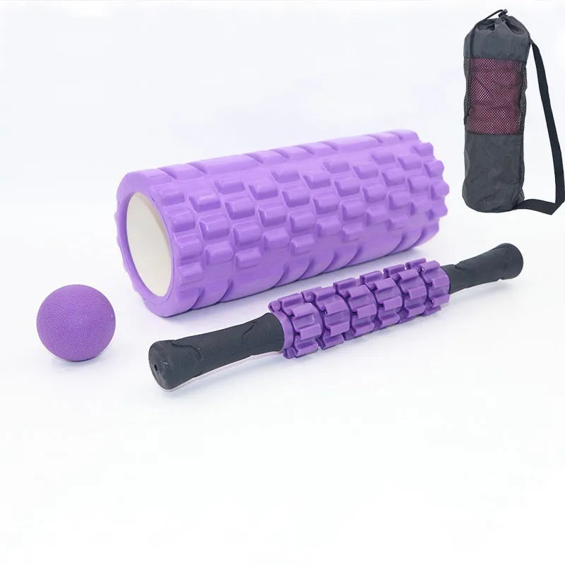 Black 33cm long fitness foam roller with six segmented pieces on a plain background.