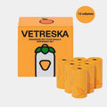 Portable dog poop bag dispenser capsule with scented inner bags in strawberry, orange and cherry blossom options