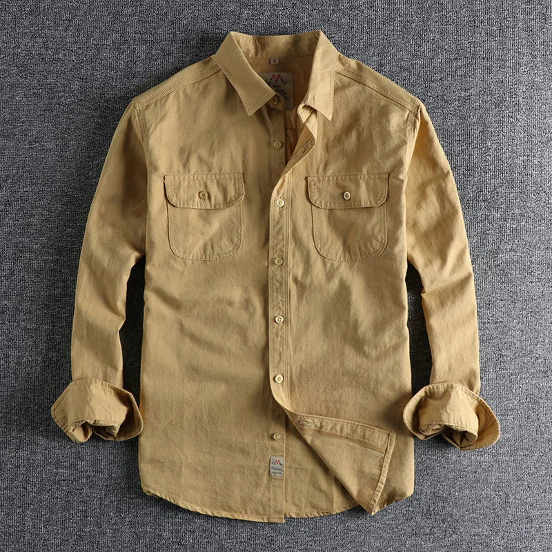 Men's solid colour cotton long sleeve shirt in cardigan style, shown in light blue.