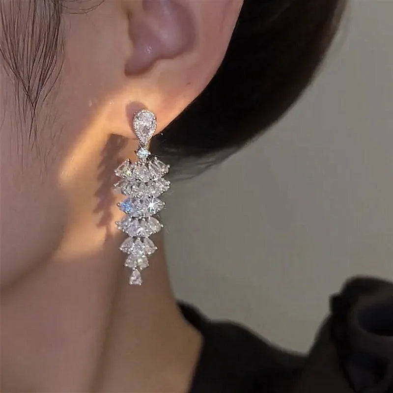 Silver pagoda colour zircon Christmas tree shaped drop dangle earrings on a stud fastening.