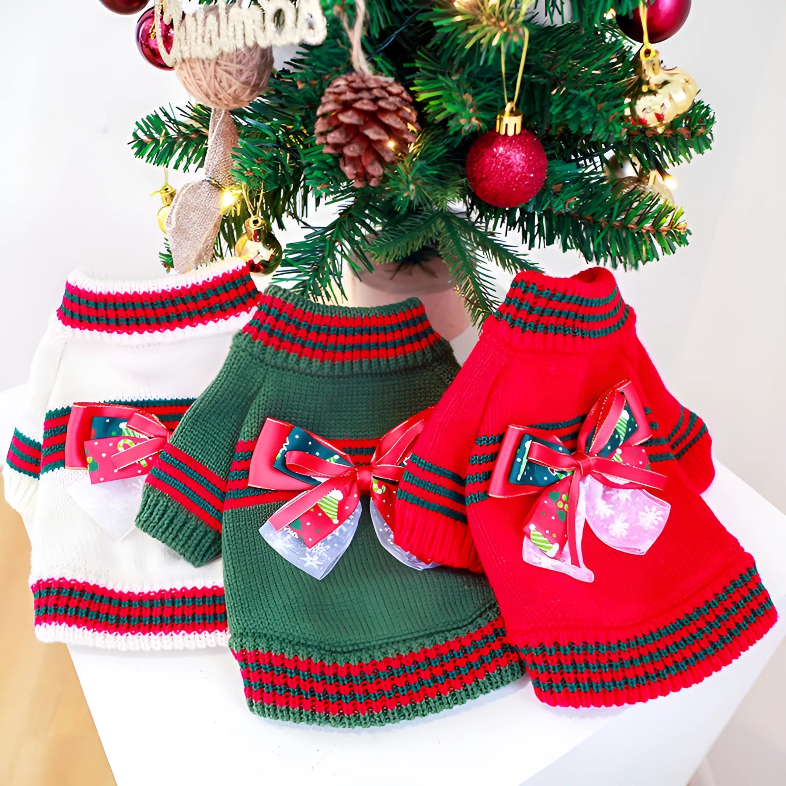 Red and green dog Christmas sweater shown on small to large breed dogs with festive holiday design
