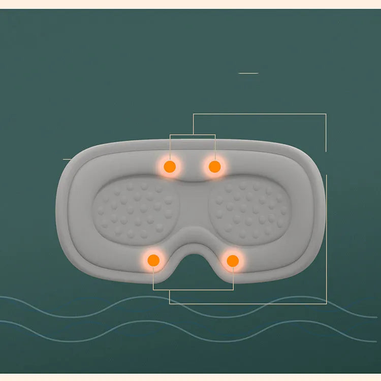 Portable green eye SPA massage goggles with suede shell on a grey background.