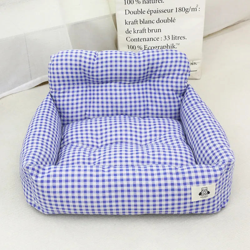 Grey and blue plaid stain-resistant cloth dog car nest in small and large sizes.