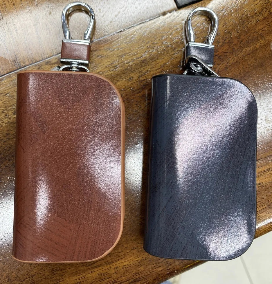 Genuine cowhide leather car key case in black with a frosted finish.