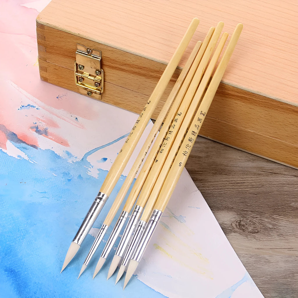 Six wooden-handled pointed hook line pen brushes with wool tips arranged together