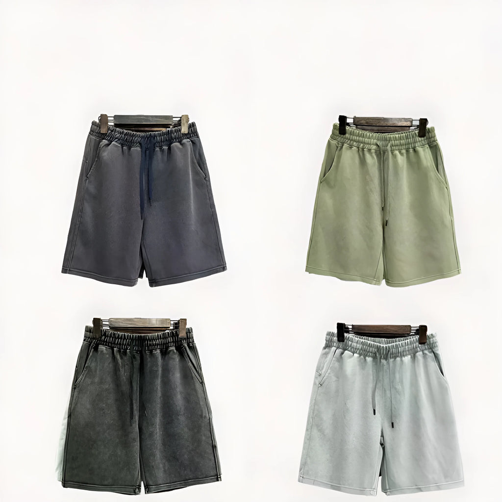 Men's cotton distressed shorts in loose straight-leg fit showing navy blue, mud lime, ash black and grass green colour options