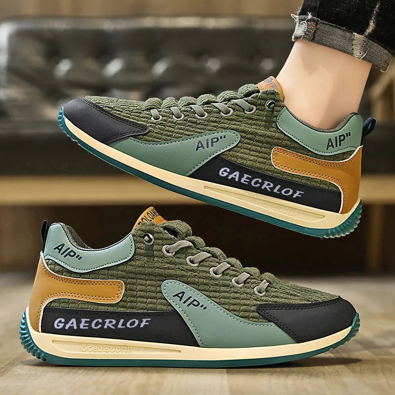 Men's grey and green mesh running shoes with low-top design and lace-up closure