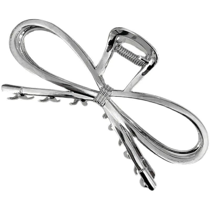 Bow barrette hair clip with back head grip in gold or silver alloy finish