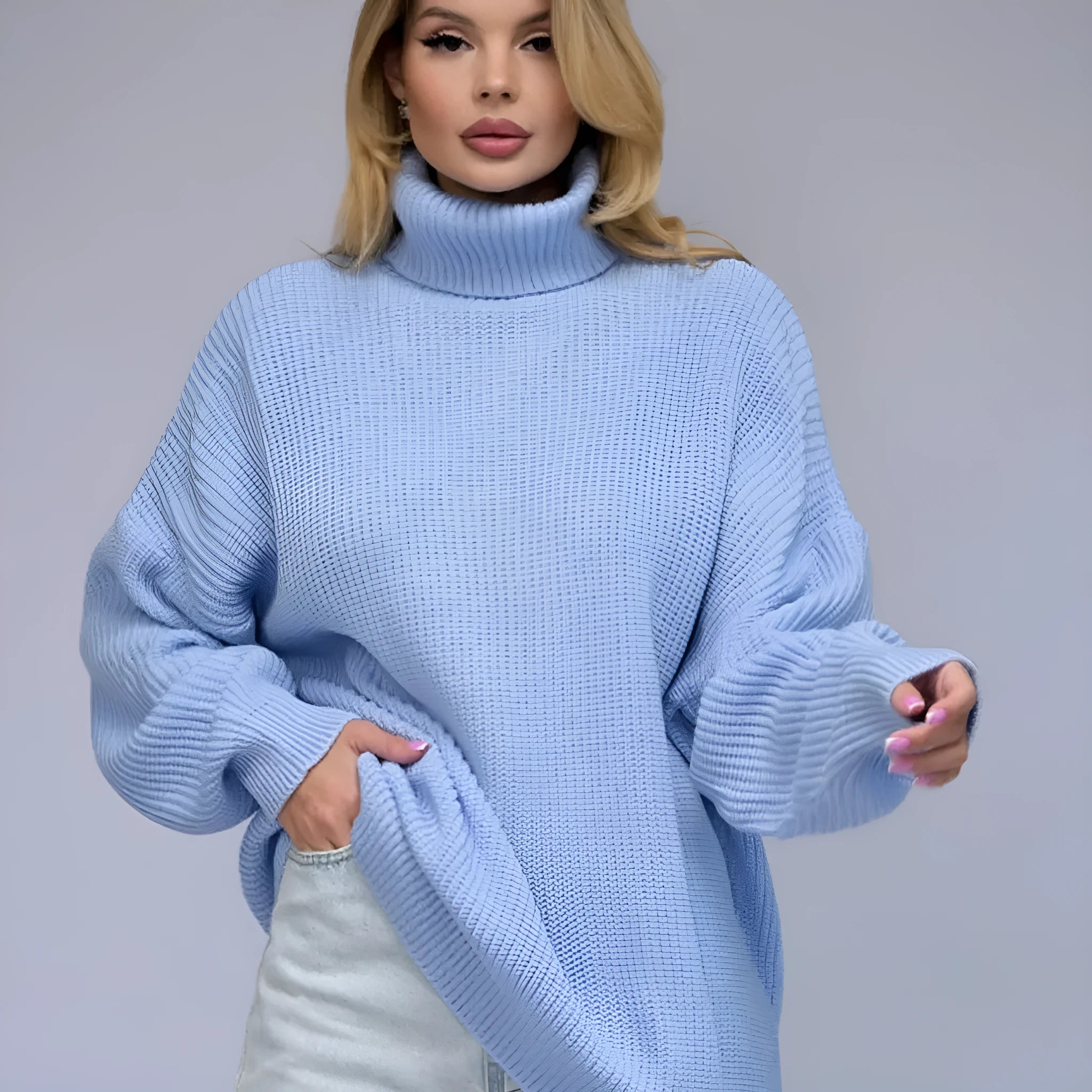 Women's solid colour high neck pullover sweater in a loose fit, shown in sky blue