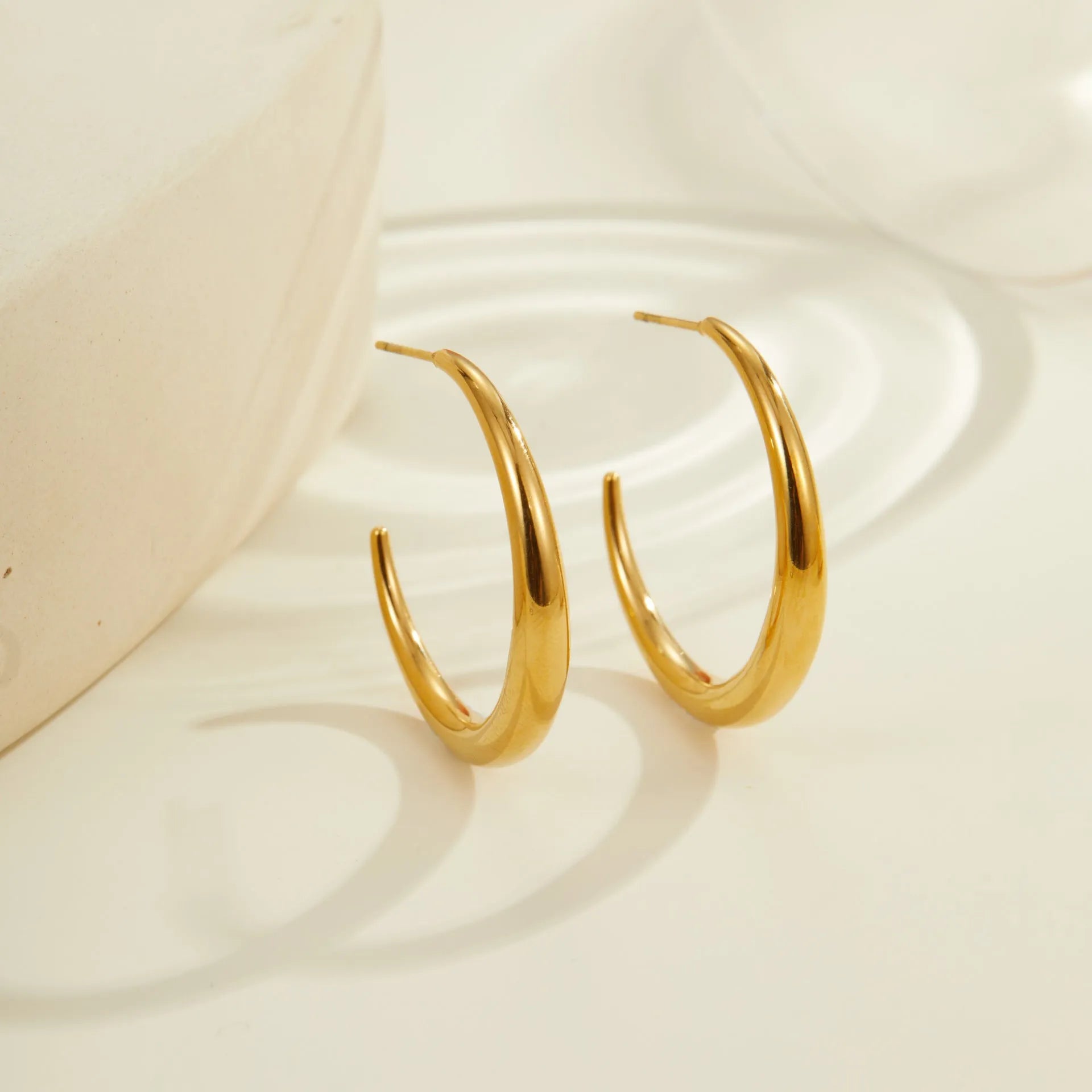 Titanium steel geometric hoop earrings with 18K gold plating in large and small sizes