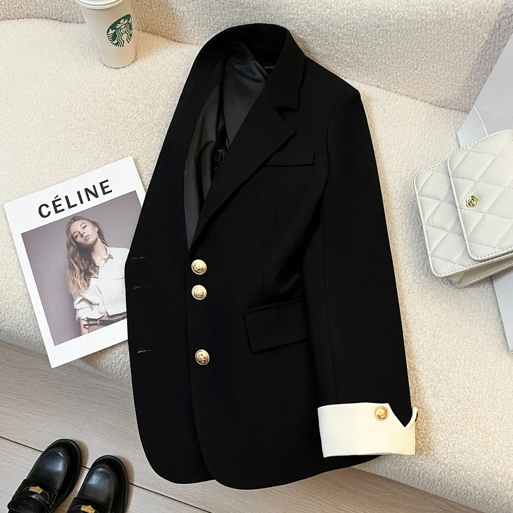 Women's loose-fitting mid-length polyester coat in milky white with pockets.