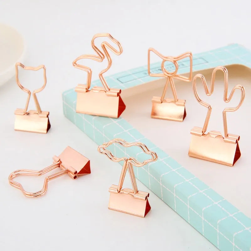 Gold metal paper clip with decorative charm attachment in flamingo design