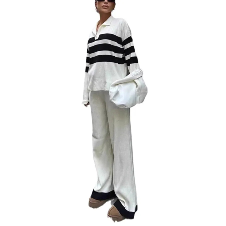Women's black and white striped knitted two-piece set with polo collar shirt and matching trousers