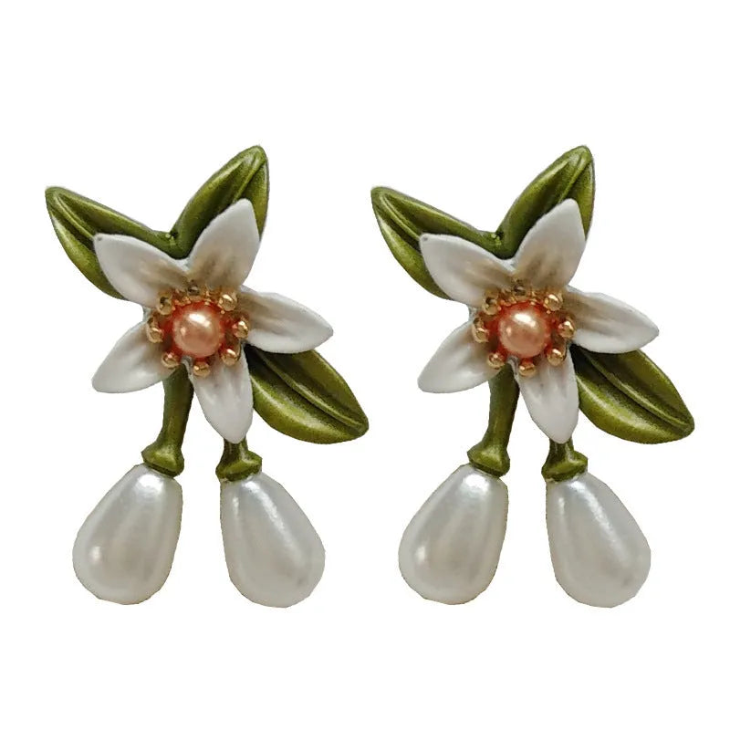 Women's alloy flower earrings with sterling silver needle contrasting colour detail, shown in clip-on and stud styles