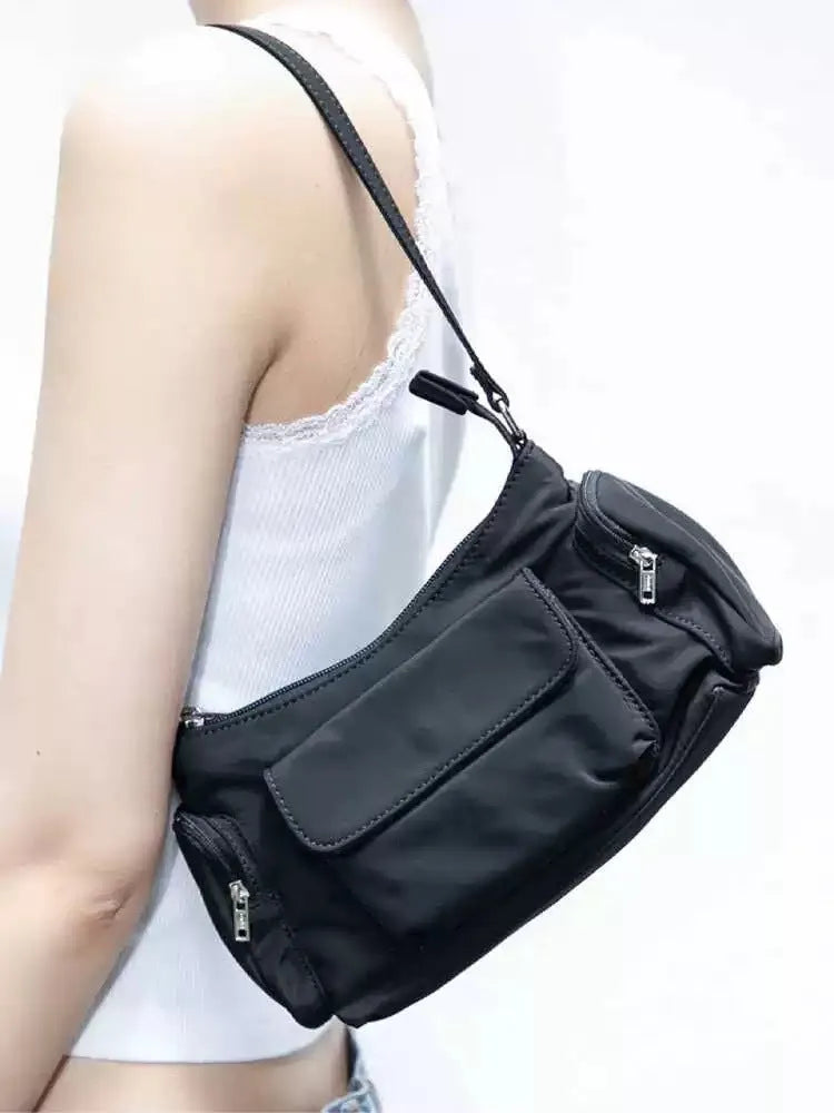Black nylon unisex shoulder bag with double pockets and side line detail