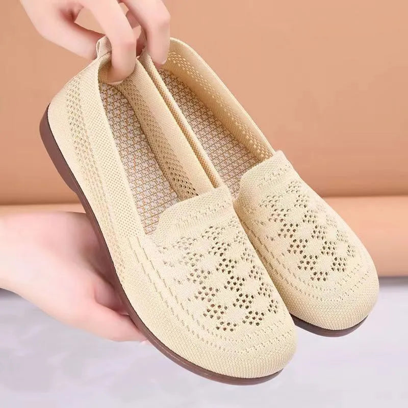 Women's beige low-top mesh tennis shoes with a round toe and anti-skid PVC sole, shown on a neutral background.