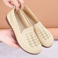 Women's beige low-top mesh tennis shoes with a round toe and anti-skid PVC sole, shown on a neutral background.