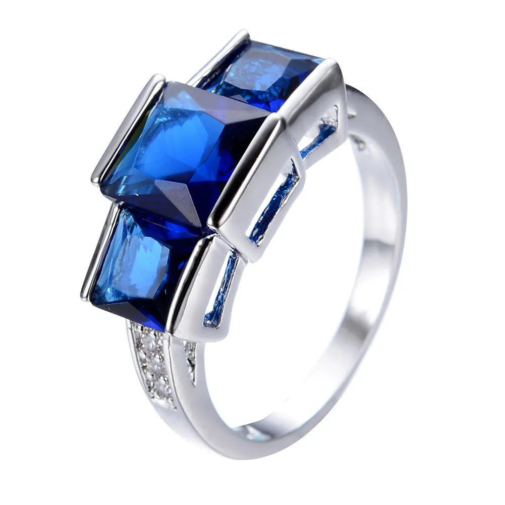 A geometric copper ring in multiple colour options on a size chart showing rings 6 to 10.