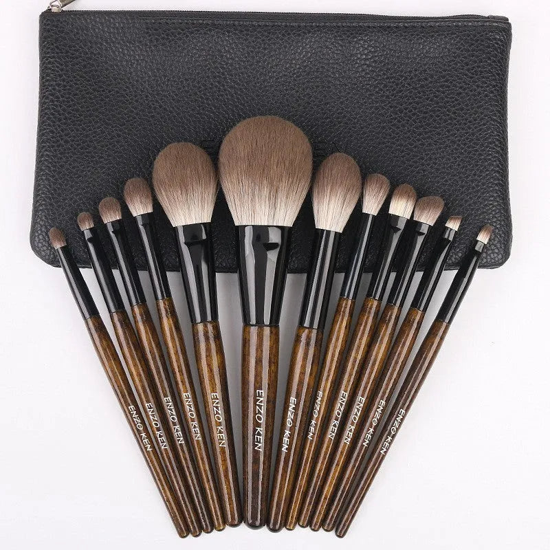 12-piece makeup brush set with wooden handles and a grey PU case