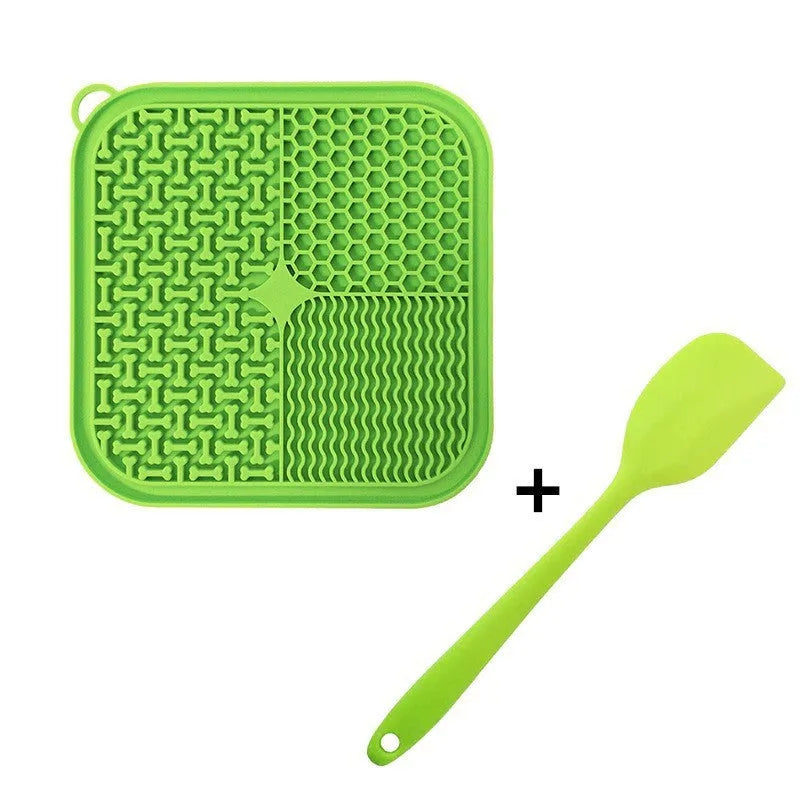 Square orange silicone dog licking mat with suction cups on back and textured surface