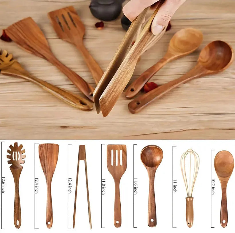 Seven-piece set of wooden cooking utensils including spoons and shovels on a kitchen counter.